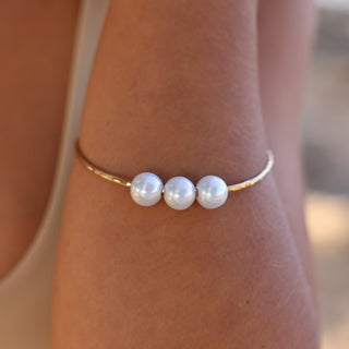 Triple White Pearl Bangle in Gold handmade in Hawaii on wrist