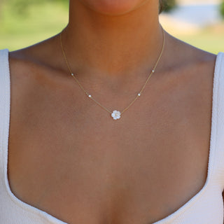 Woman wearing plumeria mother of pearl necklace, Misha Hawaii