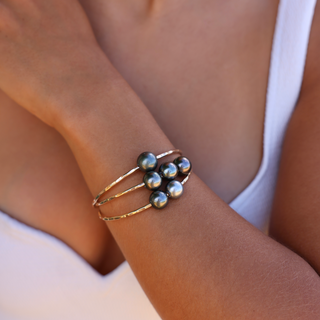 Double Tahitian pearl bangle in gold made in Hawaii on wrist