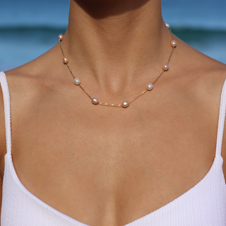 Woman wearing Lisa multicolor pink pearl necklace, Misha Hawaii