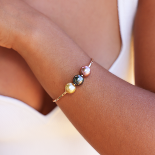 multicolor pearl bangle in gold made in Hawaii on wrist
