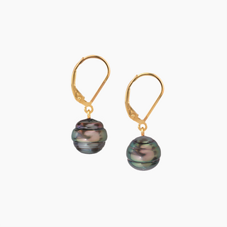 A pair of gold leverback earrings with round, iridescent dark gray-green baroque pearls, shown on a plain light gray background.