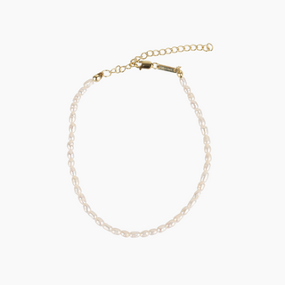 White pearl anklet on a white background