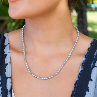 Akoya Keshi Pearl Strand with gold clasp on model