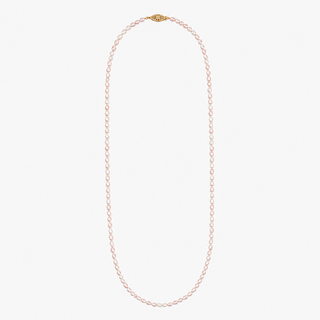 A delicate pearl necklace with a gold clasp, displayed vertically against a solid off-white background.