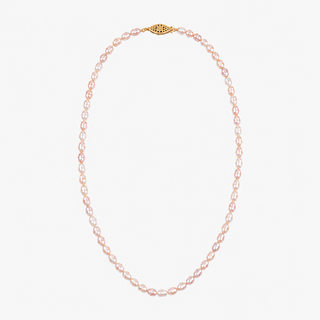 A delicate necklace made of small, light pink freshwater pearls with a textured gold clasp, displayed on a clean, light gray background.