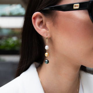 Multicolor pearl earrings, tahitian pearls and golden south sea pearls with gold leverbacks on model