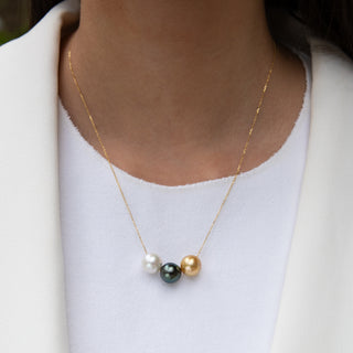 multicolor pearl necklace, tahitian pearls and golden south sea pearls float on gold chain on model