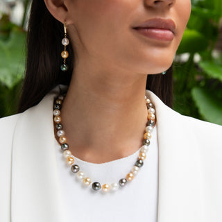 Multicolor pearl earrings, tahitian pearls and golden south sea pearls with gold leverbacks on model