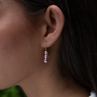 Pink Keshi Pearl earrings in 14k gold on model