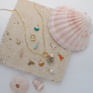 Charm necklaces in gold