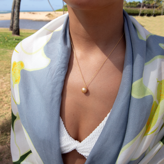 Woman wearing Island golden South Sea pearl necklace, Misha Hawaii