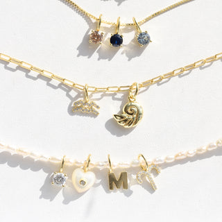 charm necklaces in gold