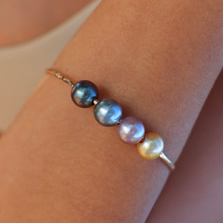 multicolor pearl bangle in gold made in Hawaii on wrist