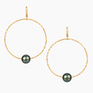 A pair of gold hoop earrings with textured circular wire and a small dark gray pearl bead at the bottom of each hoop, shown on a light gray background.