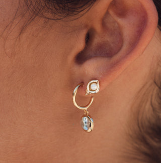 Blue Topaz Hoop Earrings in Gold on model