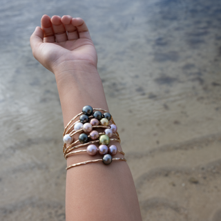 Triple pink pearl bangle in gold made in hawaii on wrist