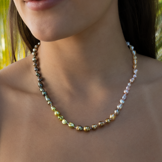 Rainbow keshi pearl strand in 14k gold on model