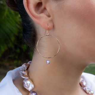 Pink Keshi pearl hoop earring in 14k gold on model