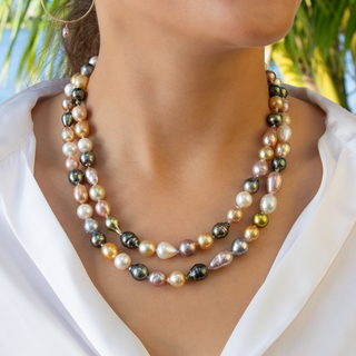 Woman wearing 38 inch rainbow pearl rope strand doubled at the collarbone, Misha Hawaii