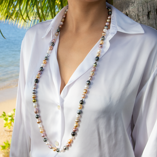 Woman wearing 38 inch rainbow pearl rope strand Misha Hawaii