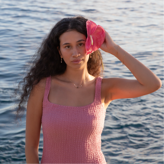 pink keshi pearl huggie on gold made in hawaii on model