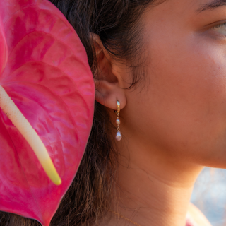 pink keshi pearl huggie on gold made in hawaii on model ear