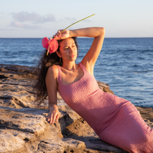Load image into Gallery viewer, Model in a pink dress wearing pink pearl keshi huggies 