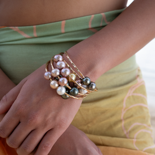 Triple pink pearl bangle in gold made in hawaii on wrist