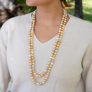 Golden south sea pearl strand with gold clasp on model