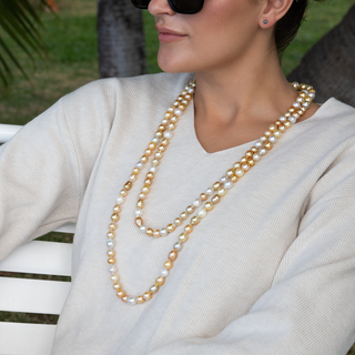 Golden south sea pearl strand with gold clasp on model
