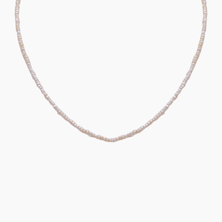 White pearl choker with toggle clasp in gold