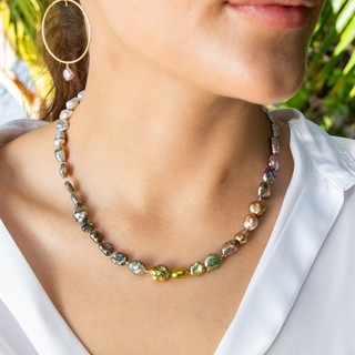 rainbow keshi pearl strand with gold clasp on model