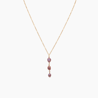 pink pearl necklace on gold chain
