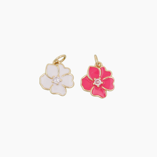 Hibiscus charm pendant in pink and white enamel with gold plating and sparkling details.