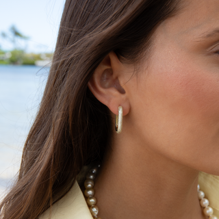 Gold hoop earrings close-up
