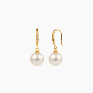 A pair of gold drop earrings with a small pavé-set diamond bar and a round white pearl dangle, shown on a light gray background.