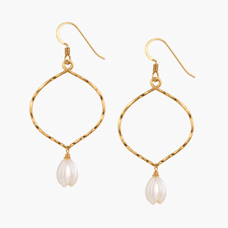 A pair of gold dangle earrings with twisted wire loops and white pearl flower drops, shown on a plain white background.