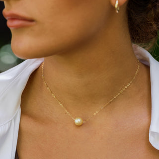 golden south sea pearl necklace in gold on model
