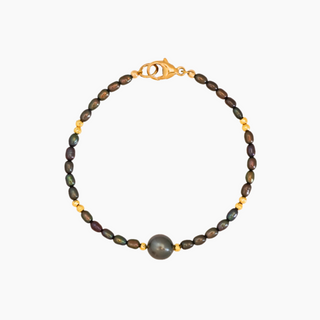 Beaded bracelet with tahitian pearl on a white background