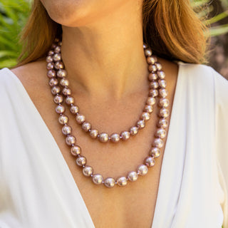 Large pink pearl strand made in Hawaii on model
