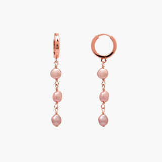 Triple Pink Pearl Keshi Huggies featuring three beautiful pink keshi pearls in rose gold finish.