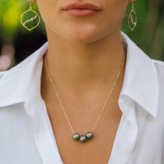 Woman wearing floating triple Tahitian pearl necklace, Misha Hawaii