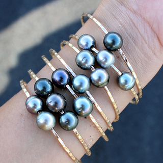 Tahitian pearl bangle in gold made in Hawaii on wrist