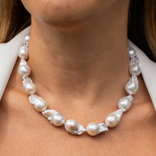 White Flameball Pearl Strand with gold clasp on model