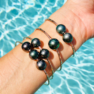 Tahitian Pearl Bangles in gold on the wrist