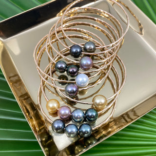 Set of nine pearl bangles in gold made in Hawaii
