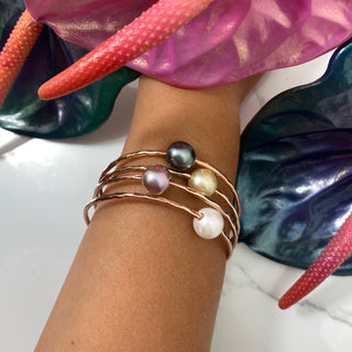 baby pink pearl bangle in gold made in Hawaii on wrist