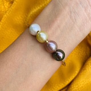 multicolor pearl bangle in gold on wrist