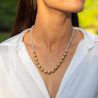 Woman wearing Mana Nui golden South Sea pearl necklace, Misha Hawaii